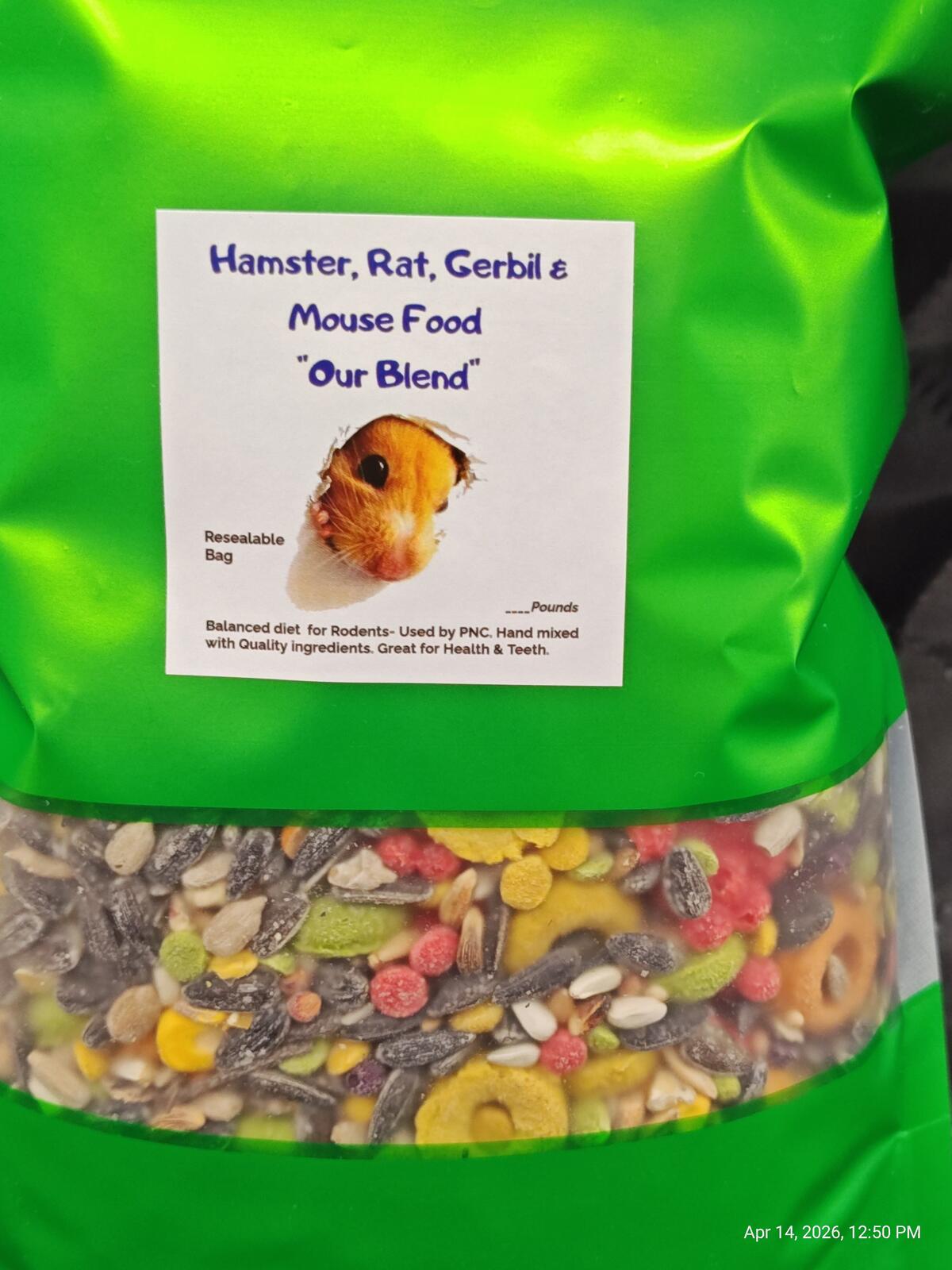 Close-up of green rodent food pouch label with visible mixed kibble below.