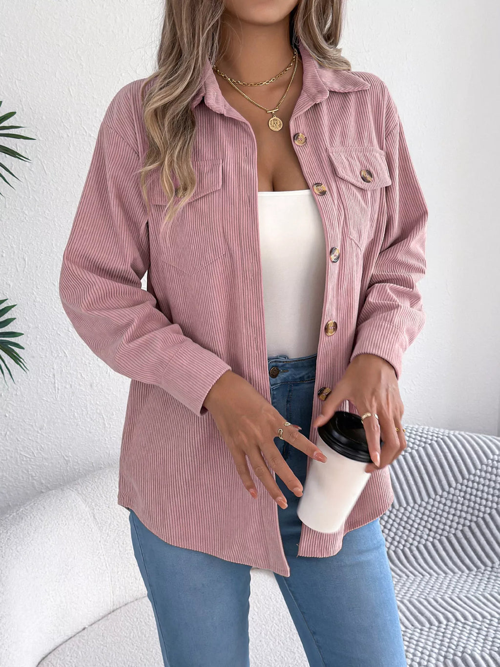 Pink corduroy shacket front view with button placket and flap chest pockets