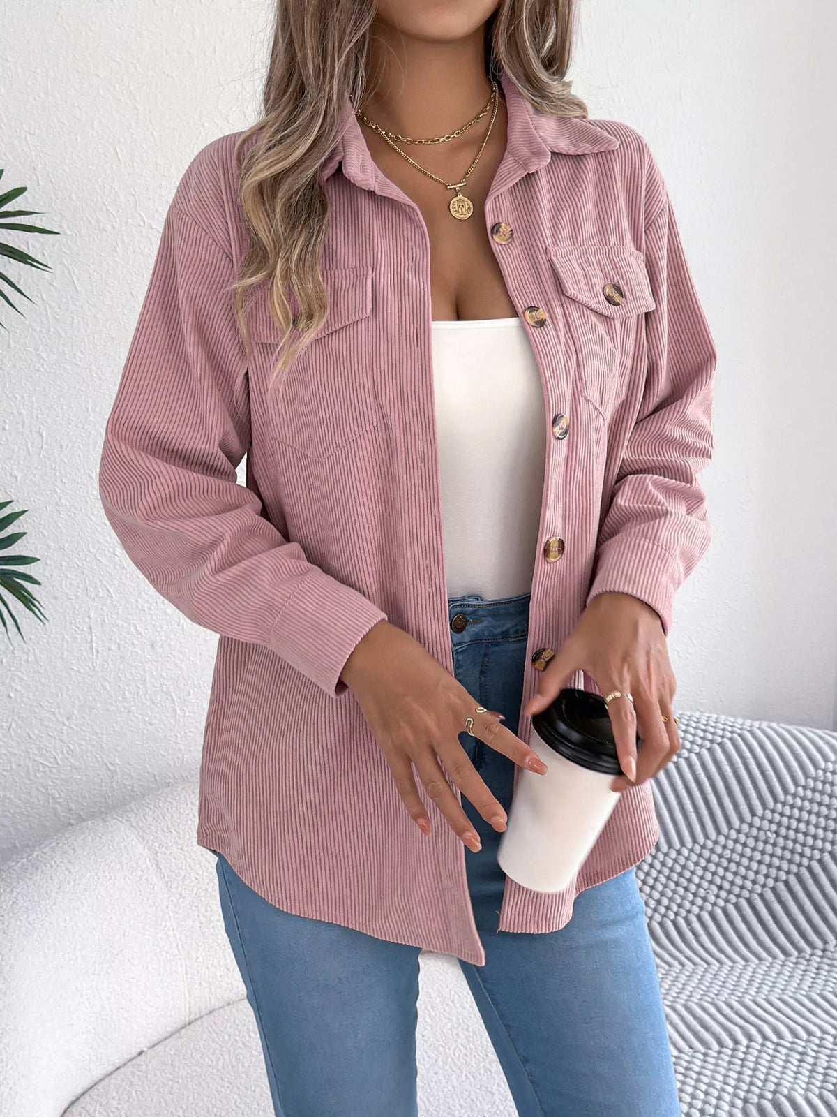 Pink corduroy shacket front view with button placket and flap chest pockets