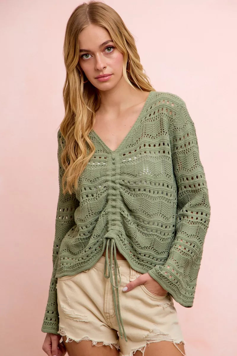 Sage green pointelle knit V-neck ruched front top with long sleeves and tie drawstring