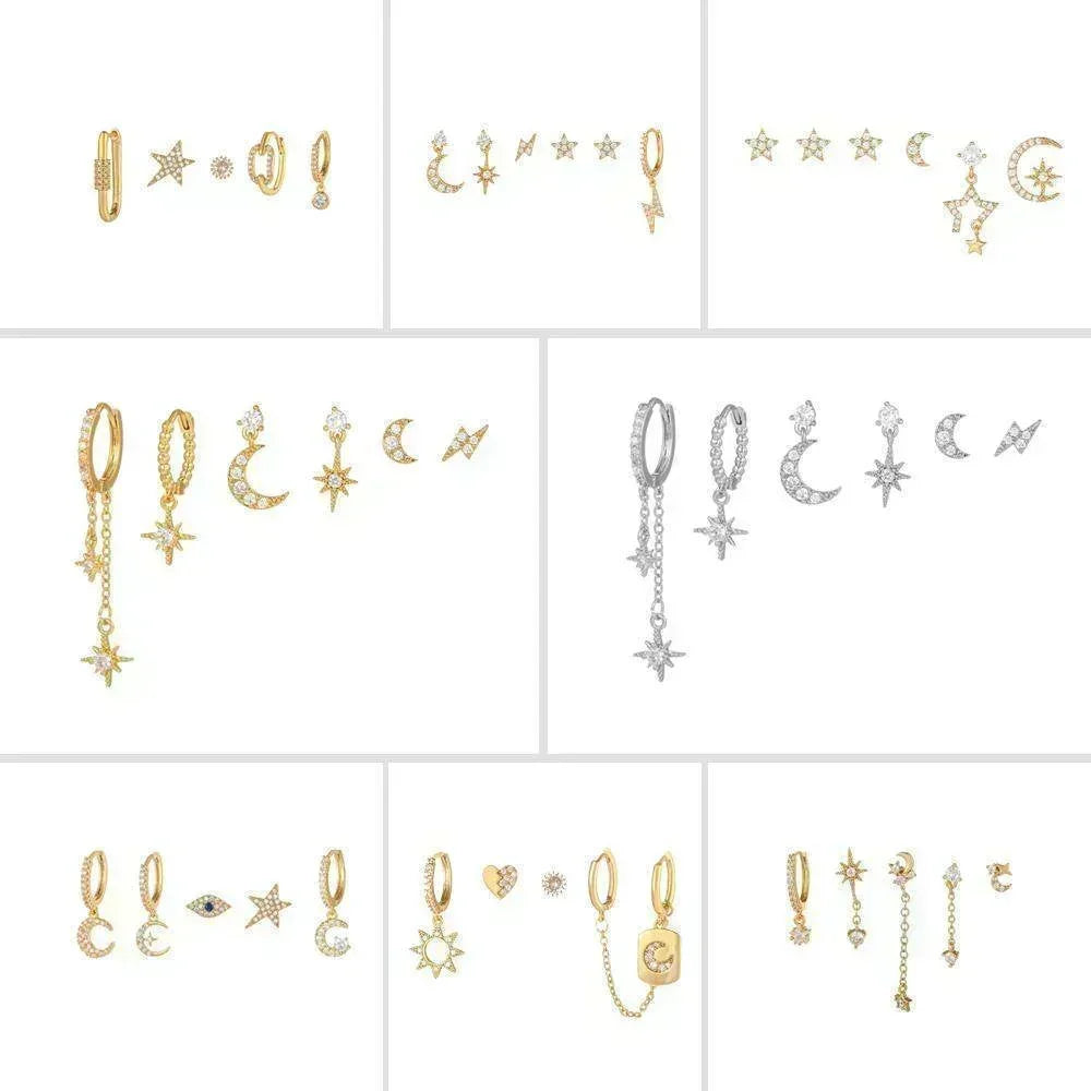Mixed gold-tone celestial earrings with moon and star charms, shown as multiple pieces.