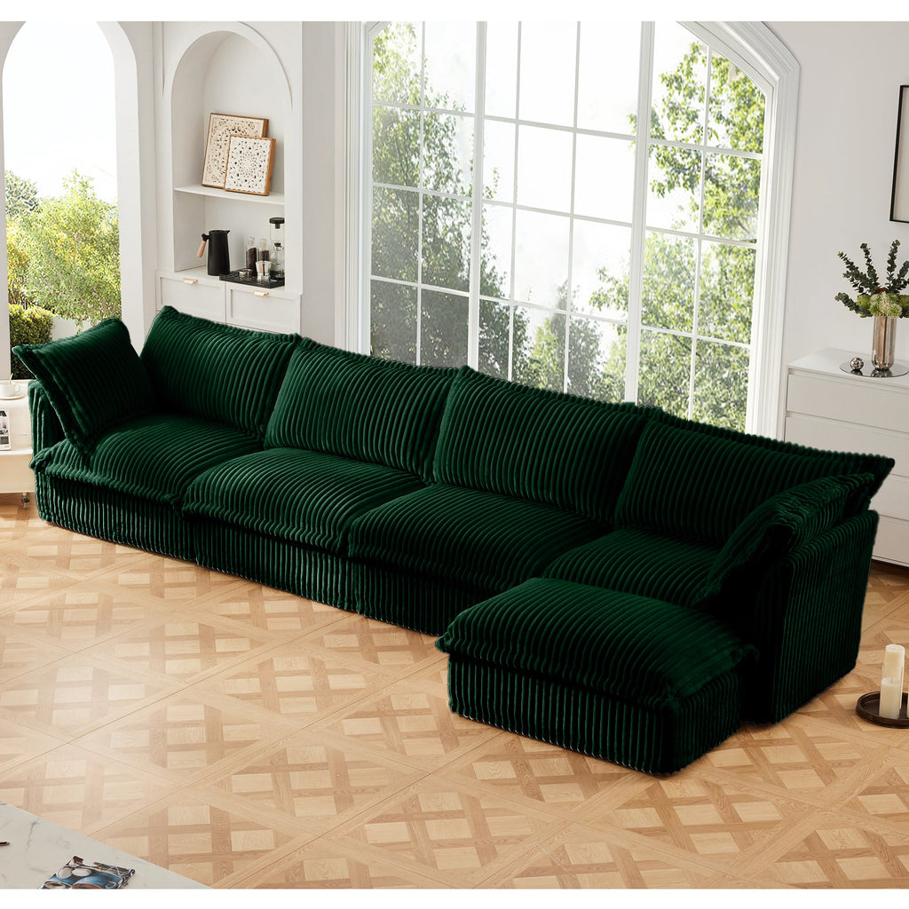 Green L-shaped sectional sofa with right-side chaise, ribbed slipcover, deep cushioned seating.