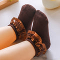 Pair of baby lace ruffle cuff socks in brown