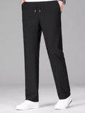 Lightweight drawstring casual pants in black with elastic waist and side pockets