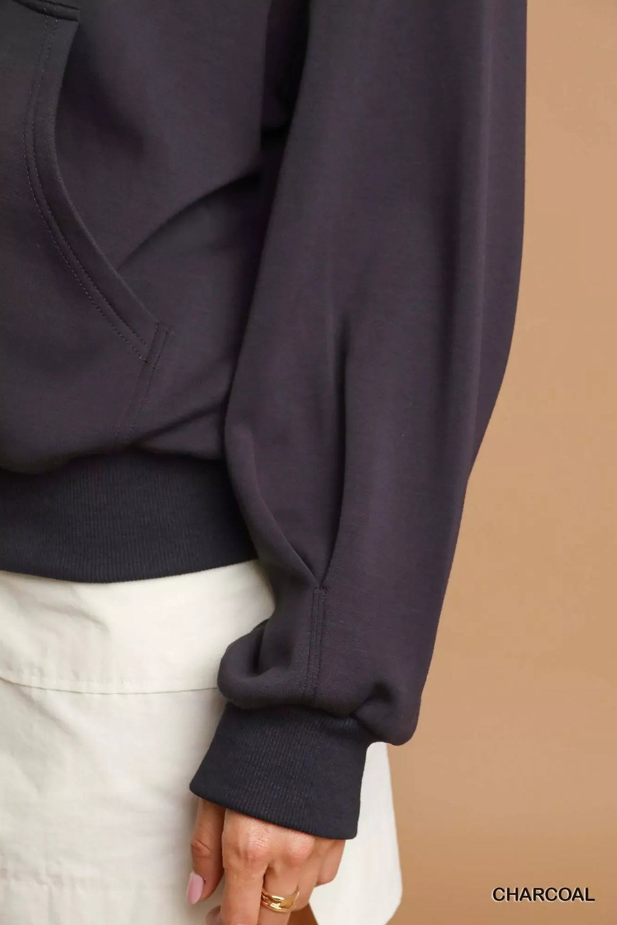Charcoal zip-up fleece jacket sleeve with ribbed cuff