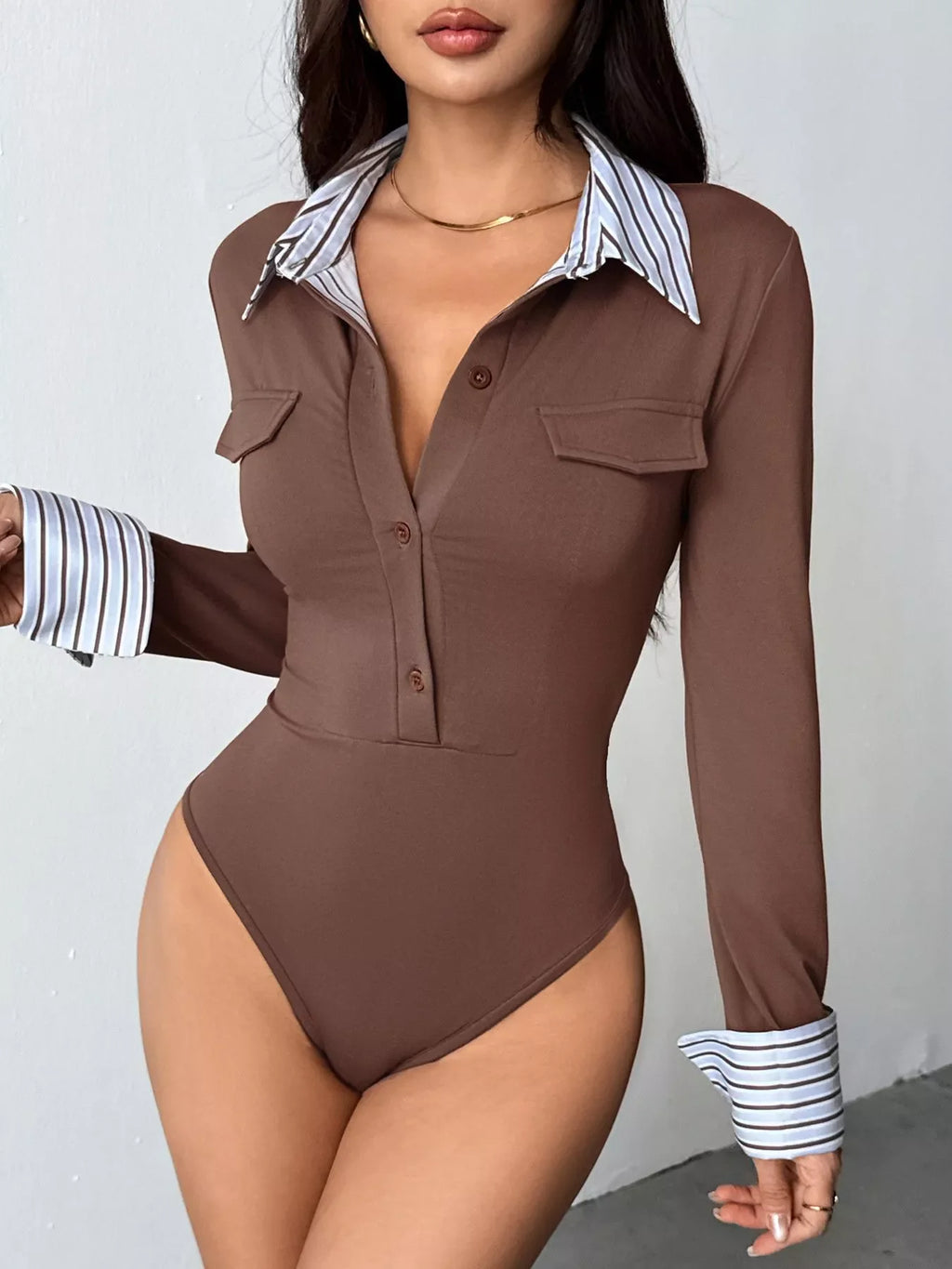 Brown button-front bodysuit with collared striped trim and long sleeves
