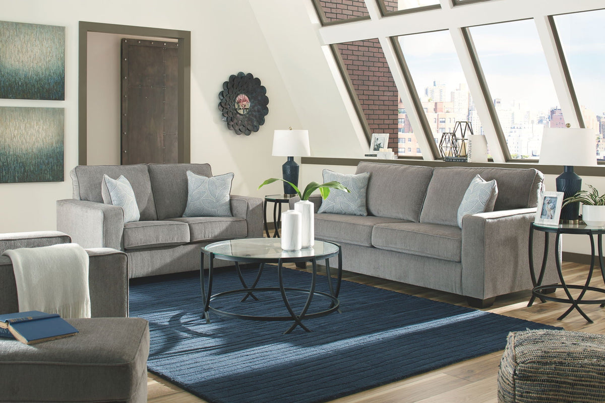 Light gray fabric sectional sofa with chaise-style seating