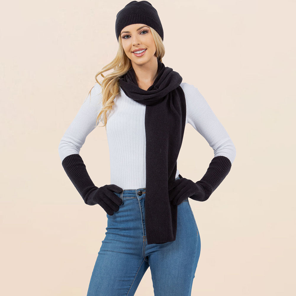Black knit beanie, matching scarf, and gloves set for winter wear