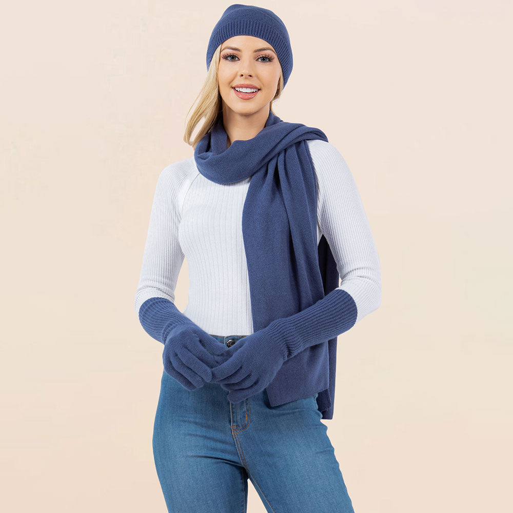 Navy knit beanie, matching scarf, and gloves set for winter wear