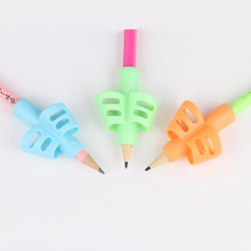 Triangular pen grip set on pencils: blue, green, and orange finger holders
