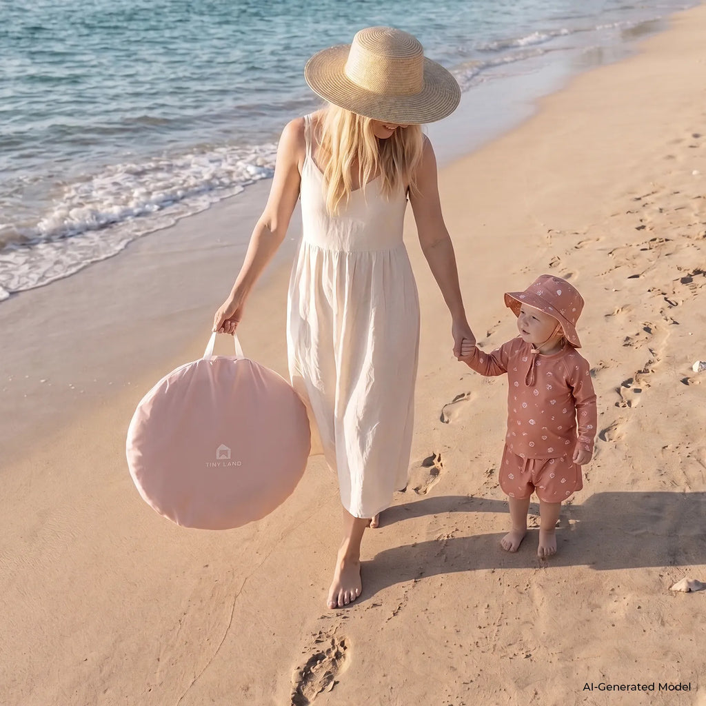 Pink fabric tent carry bag on a sandy beach