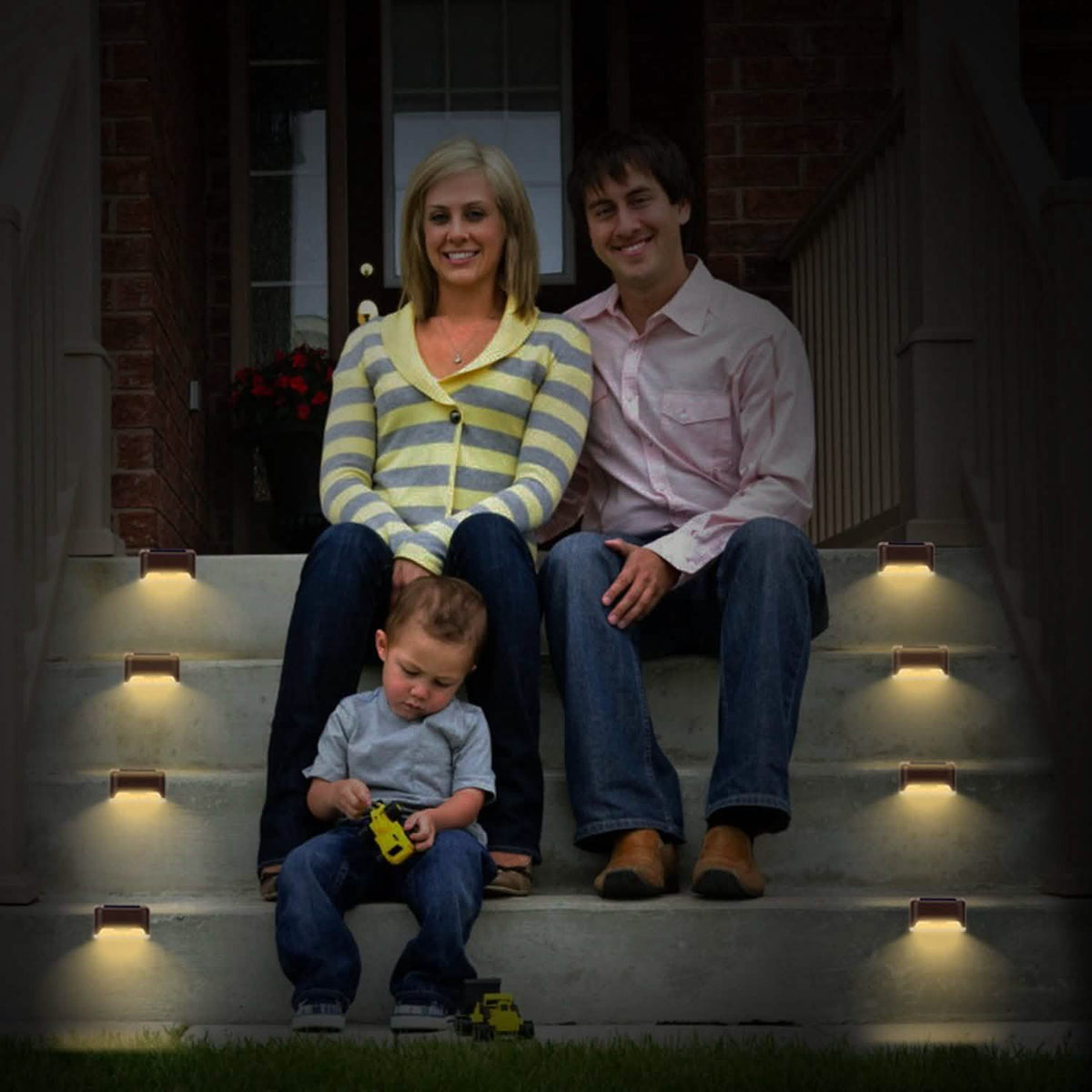 Brown solar LED step lights, four-piece set with warm white glow on stairs