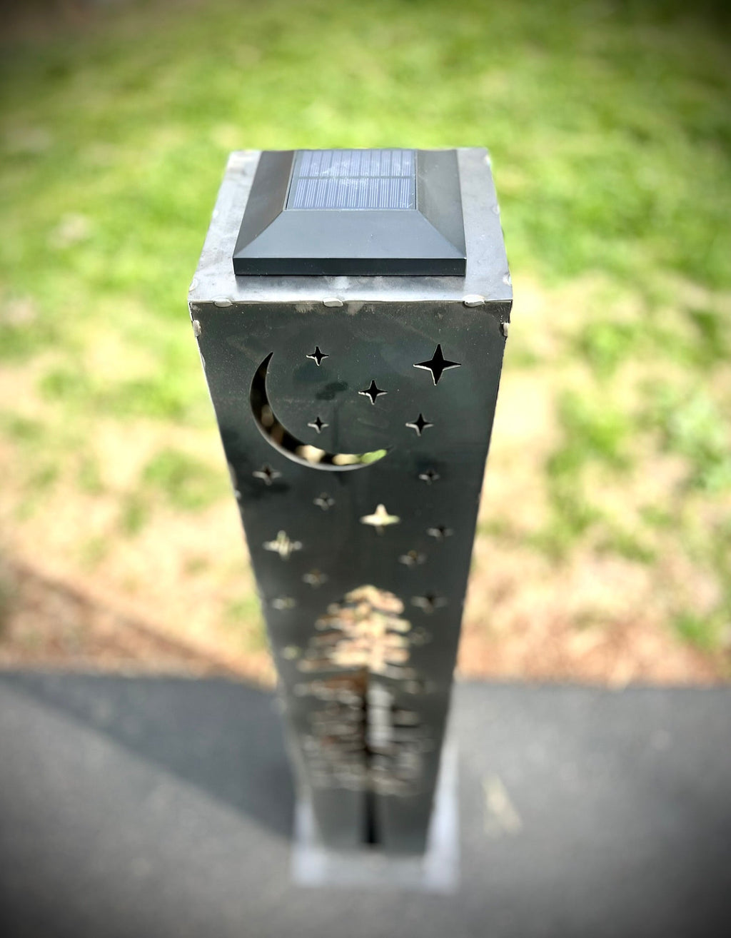 Dark steel solar pillar lantern with star and crescent-moon cutouts