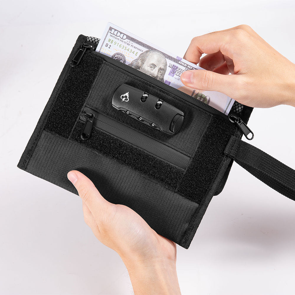 Smell proof travel wallet open with black lock device and cash, held by two hands