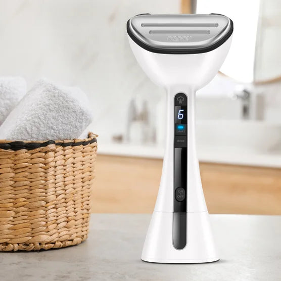 White handheld garment steamer with blue digital settings display and steam vent