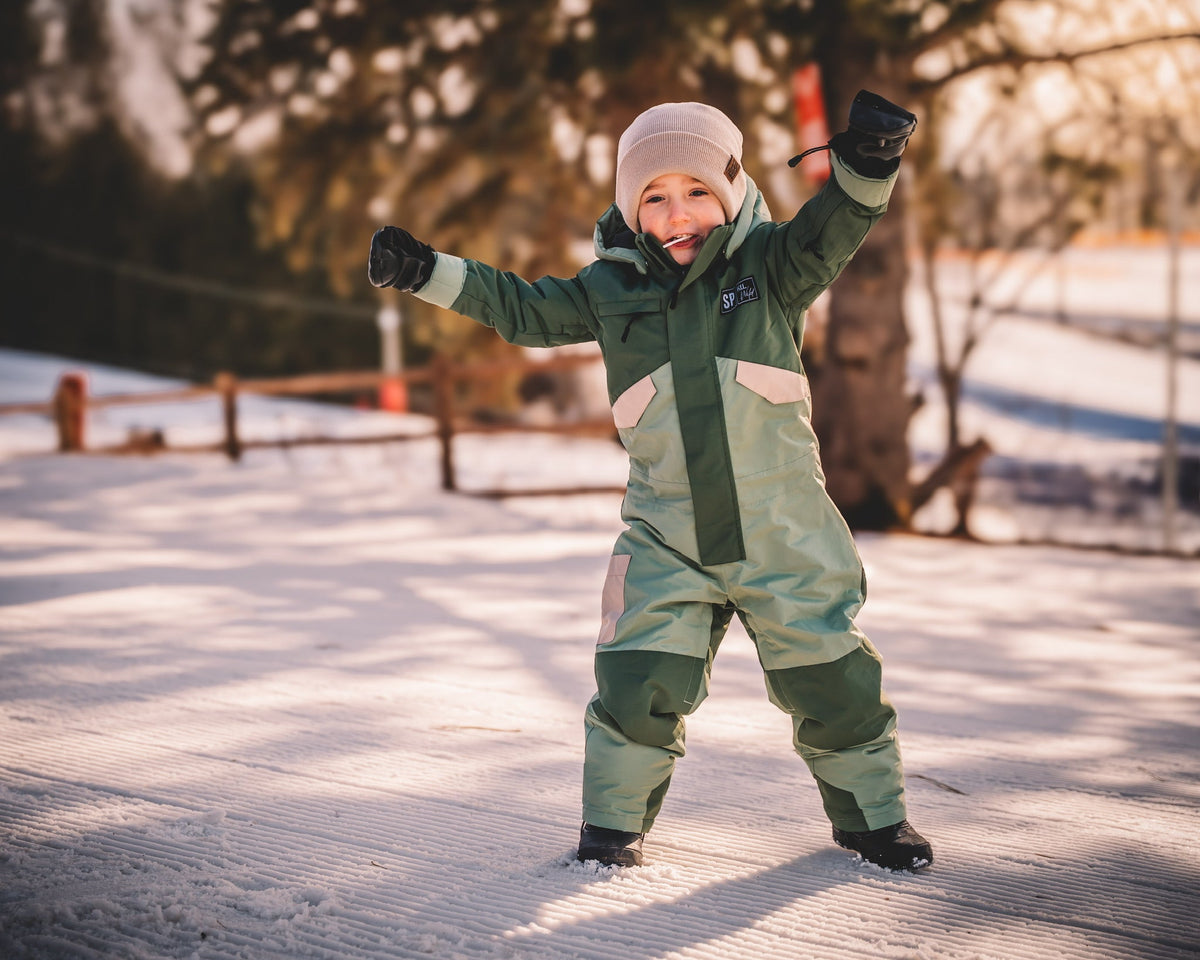 Toddler waterproof snowsuit with hood, dark green sleeves and light paneling, full body