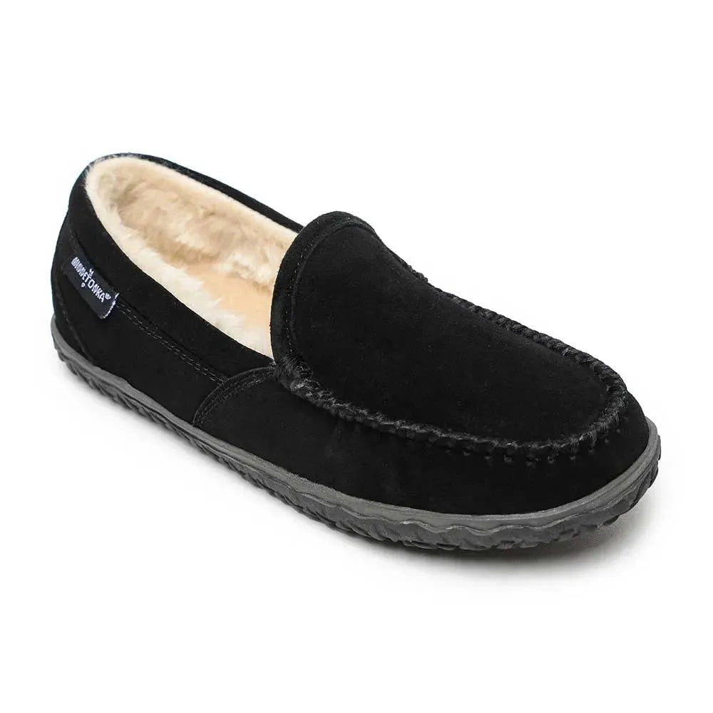 Black suede moc-toe slippers with faux fur lining and stitched side seam