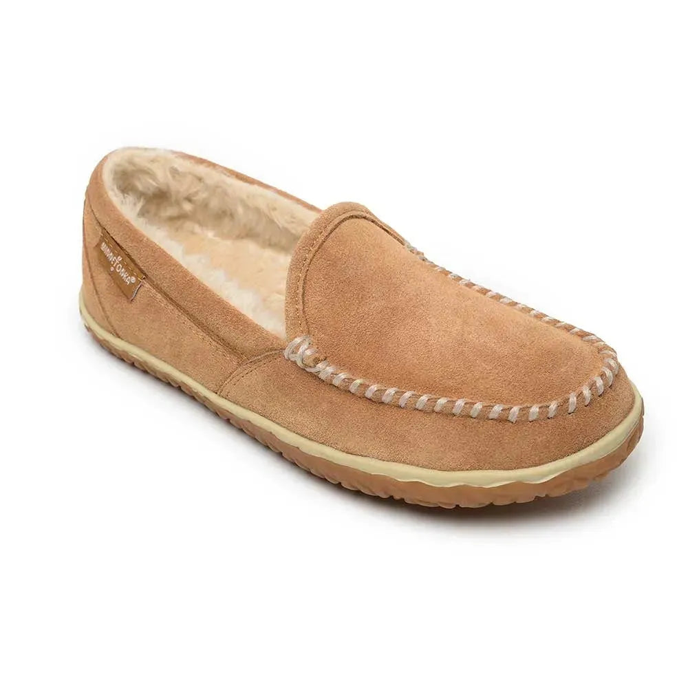 Tan suede moc-toe slippers with faux fur lining and white stitched trim