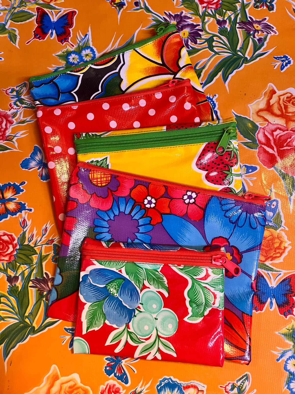 Floral zippered pouch set with red, green, yellow, blue and pink panels