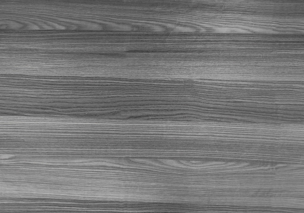Close-up of gray wood-grain finish on bookcase panel