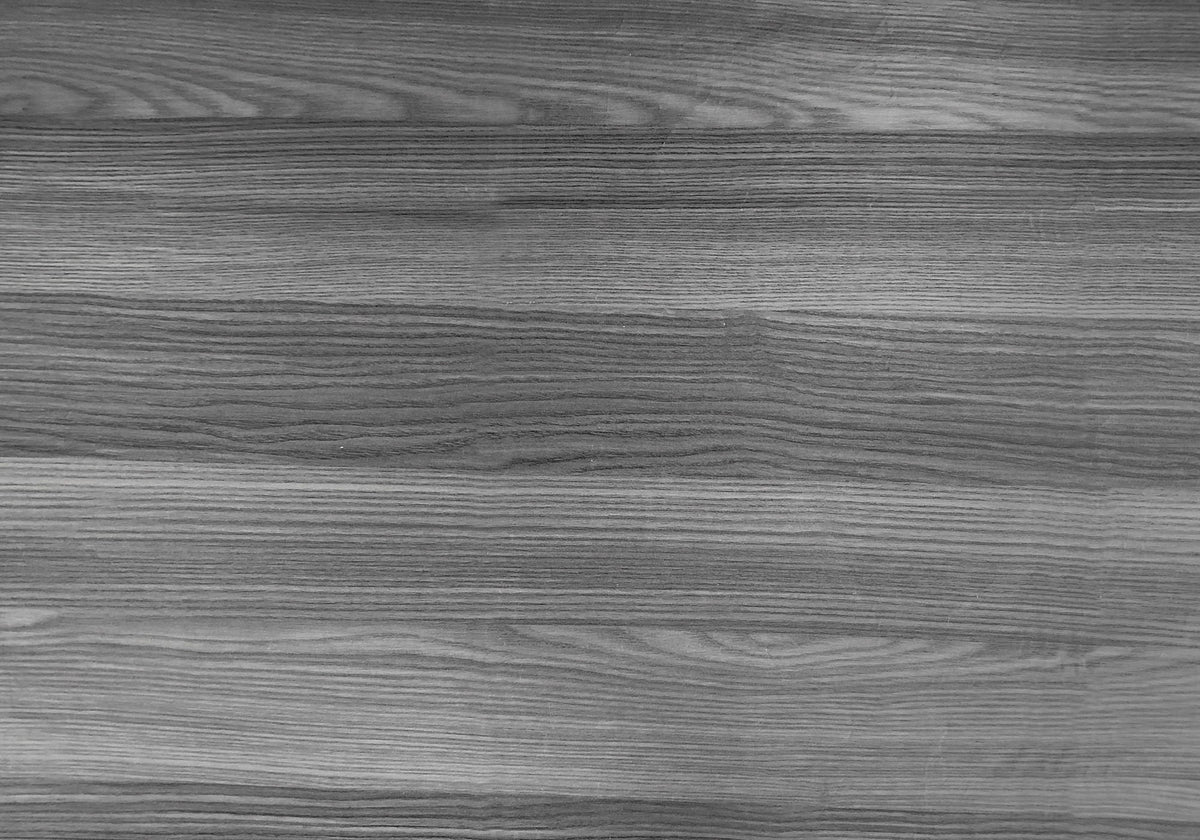 Close-up of gray wood-grain finish on bookcase panel