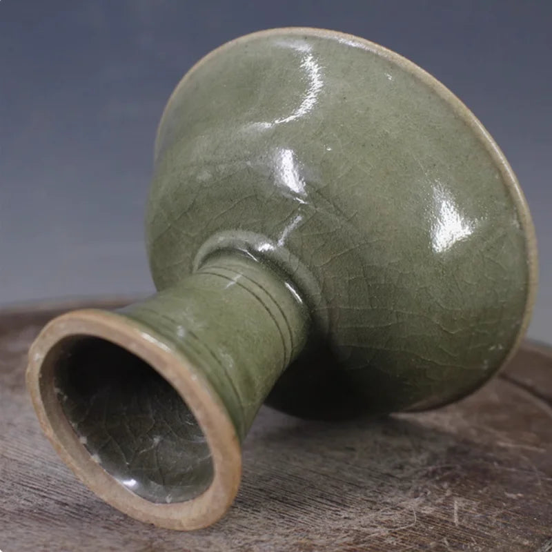 Celadon porcelain bowl with flared rim and pedestal foot, glossy glaze