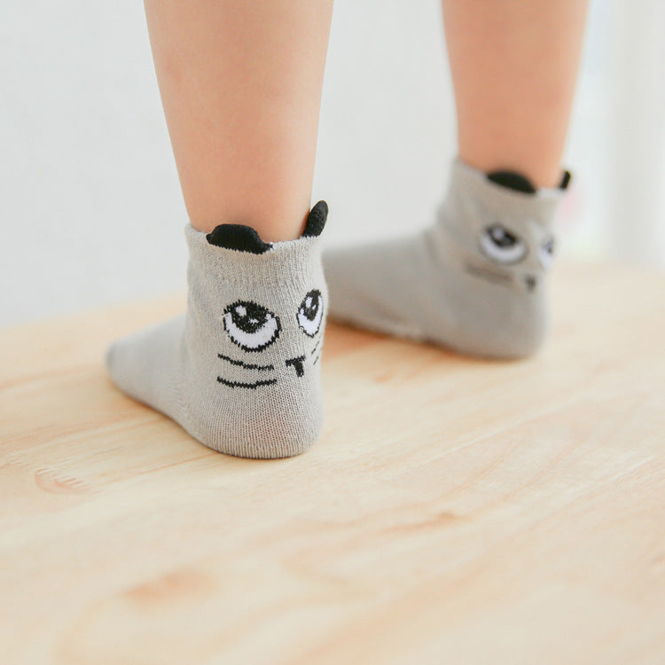 Light gray kids cotton baby socks with panda face embroidery and black ear details.