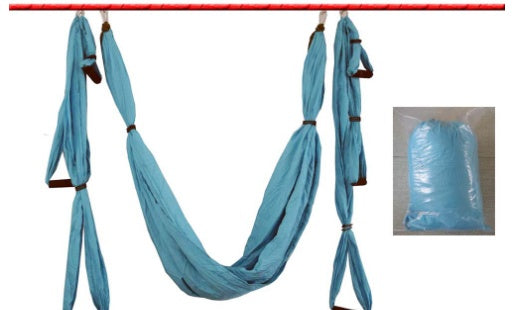 Blue yoga swing hammock with attached fabric straps