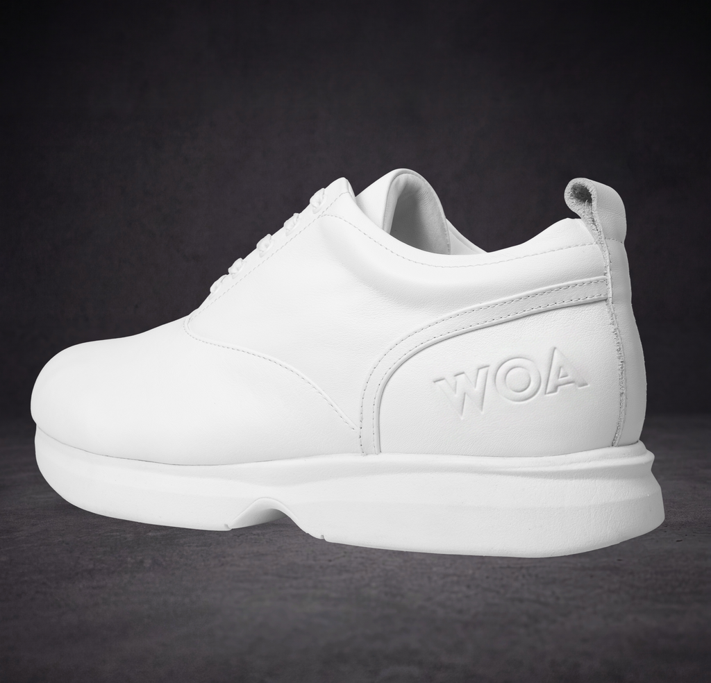 White lace-up sneaker with padded collar and WOA logo heel panel