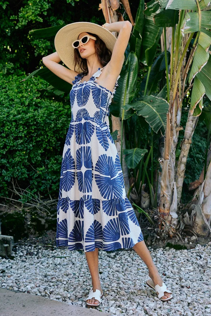 Navy and white abstract print sleeveless midi dress with smocked bodice and tiered skirt