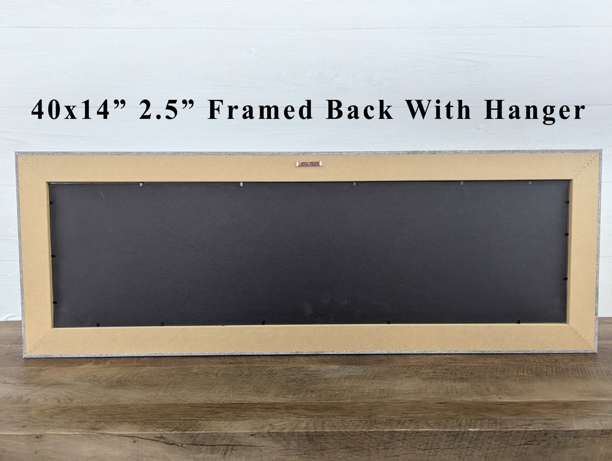 40x14" framed wall art back with hanger in light wood frame and dark backing