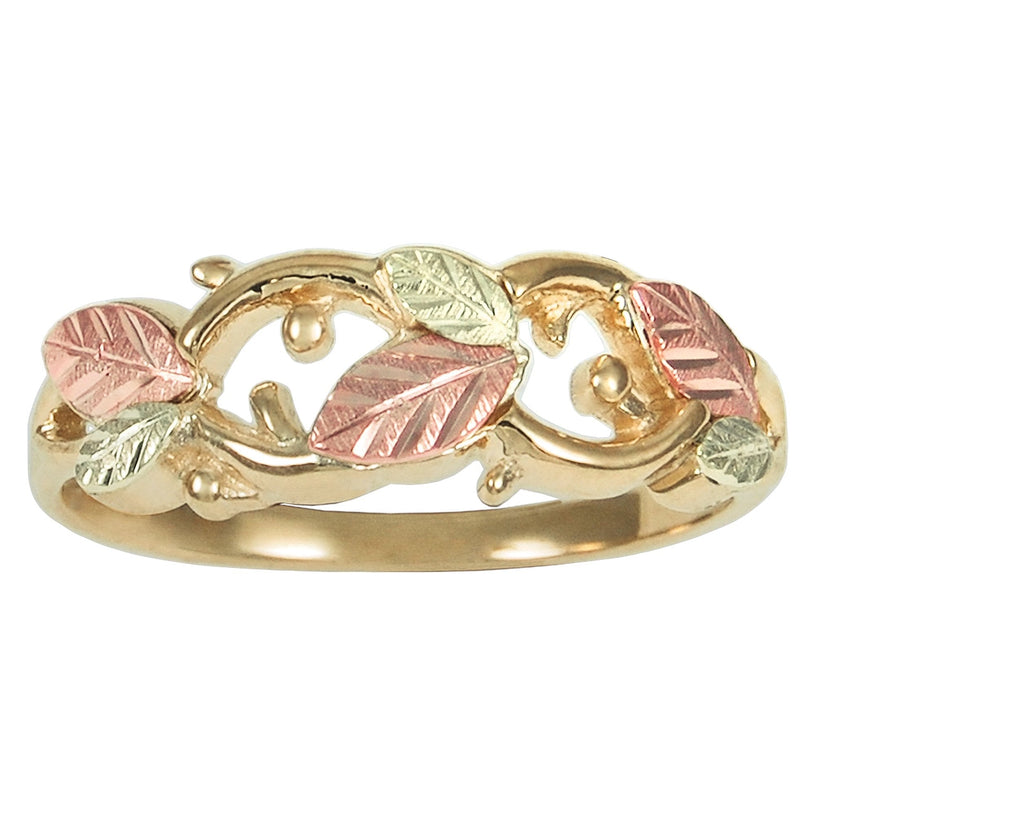 Gold-tone leaf motif ring with pink and green enamel accents, round bezel details
