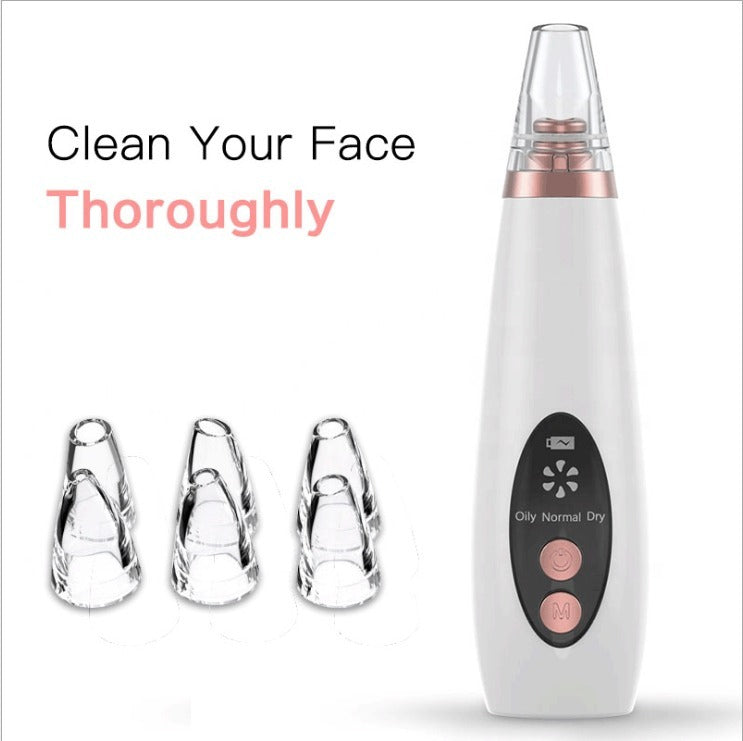 White handheld blackhead remover device with three clear suction attachments