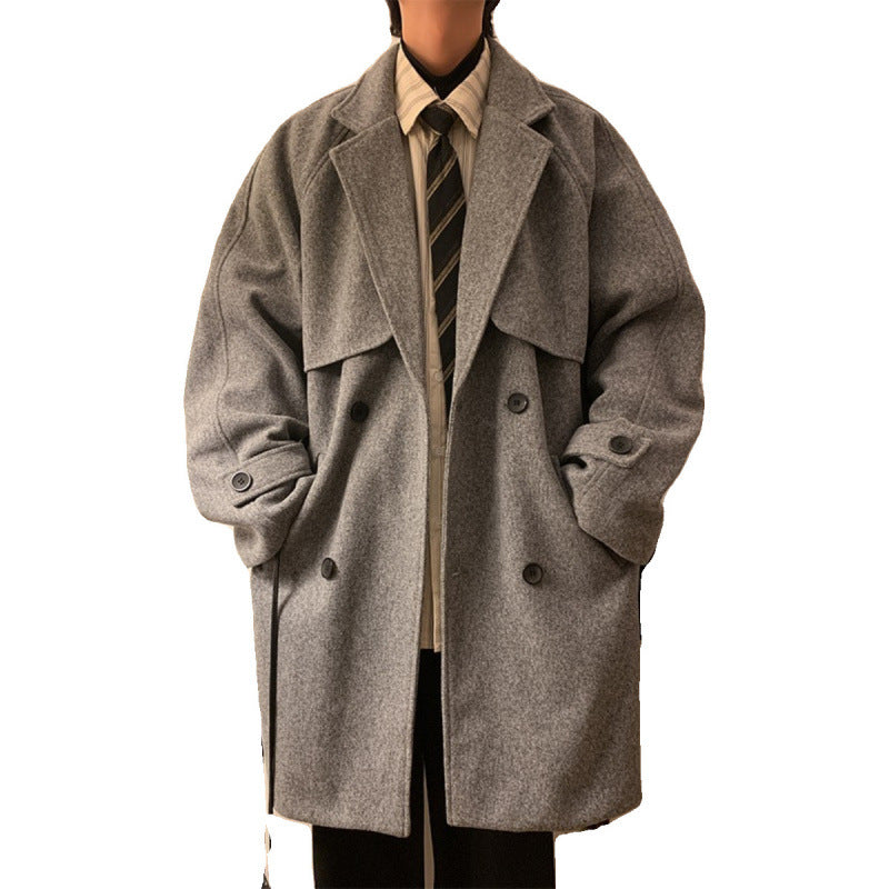 Gray mid-length wool overcoat with notched lapels, buttoned front, and cuff detailing