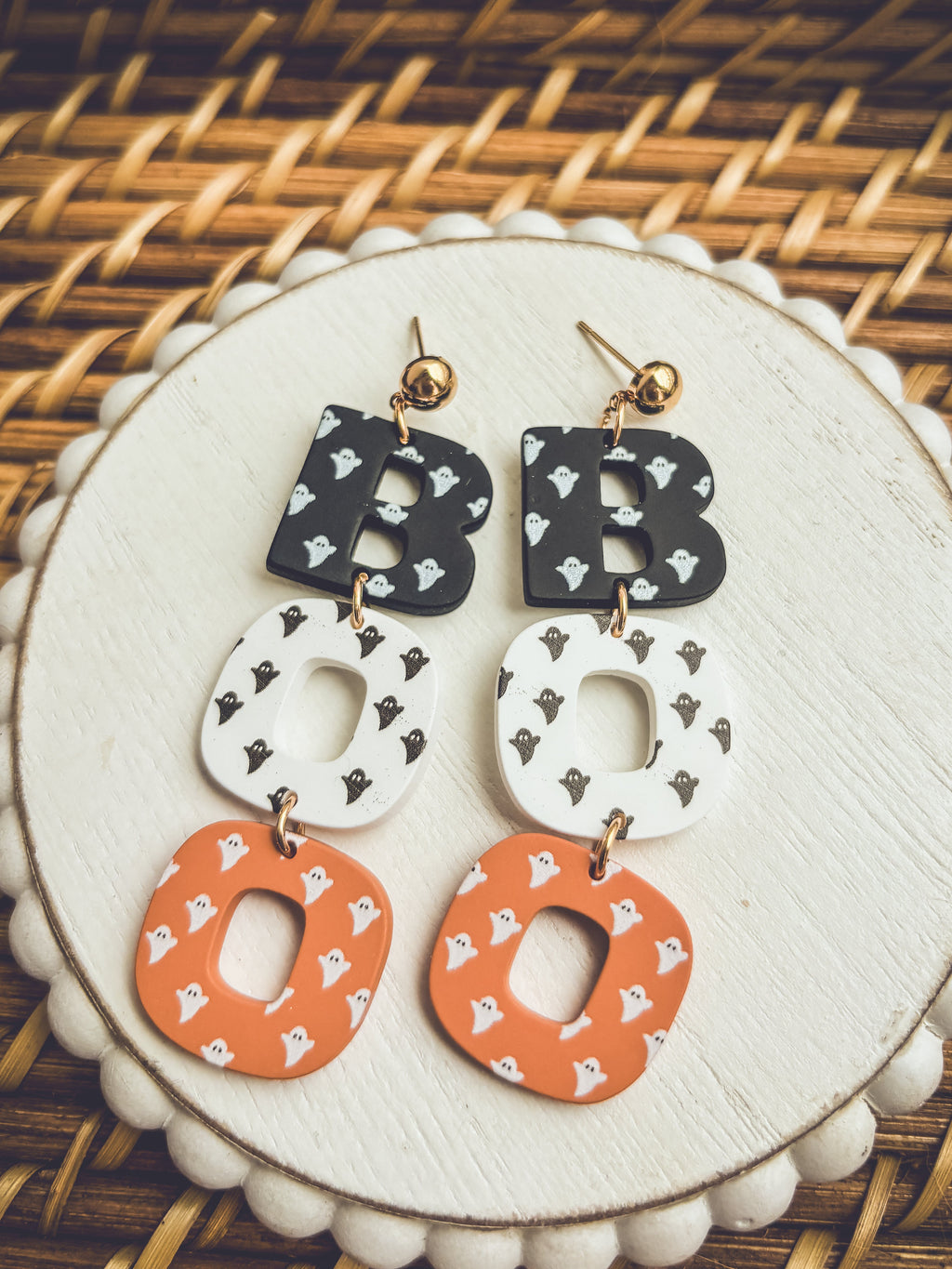 Halloween letter B earrings with black, white, and orange heart patterns
