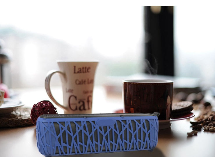 Blue solar Bluetooth speaker with woven grille, compact barrel speaker body