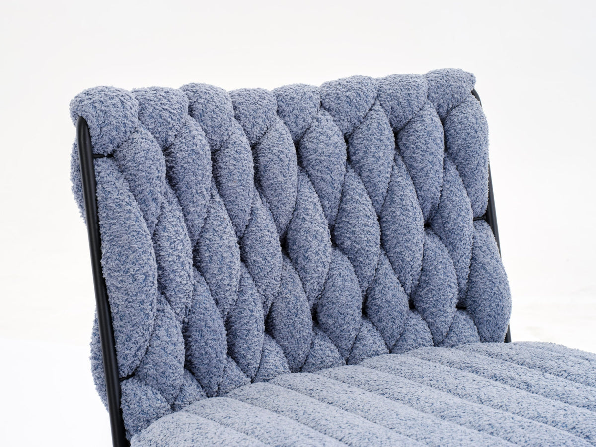 Blue tufted boucle armless chair backrest and padded seat cushion in close-up.
