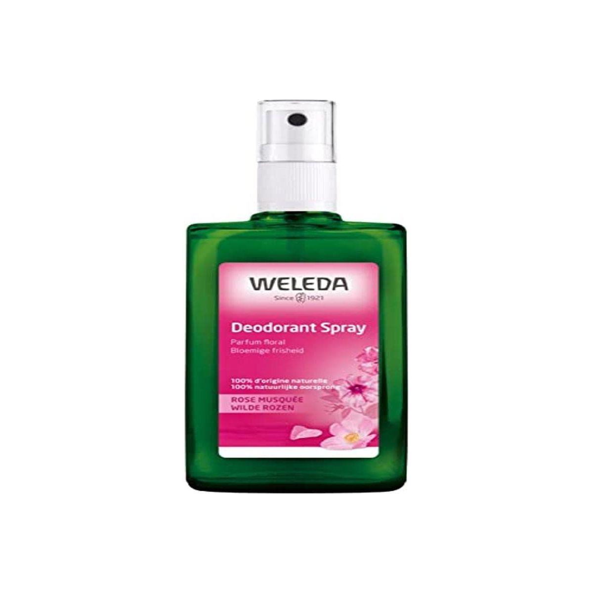 Green deodorant spray bottle with Weleda Wild Rose label