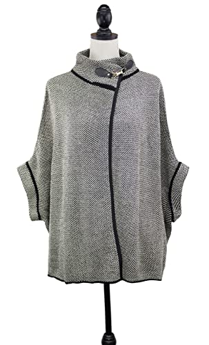 Grey speckled poncho cardigan on mannequin with black piping and button-buckle collar