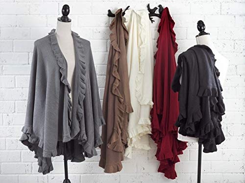 Ruffle-trim knit open-front poncho capes in multiple colors on mannequins