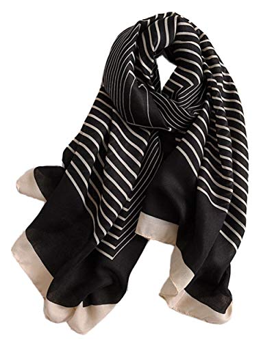 Striped oblong scarf in black with light beige wavy lines and fringed ends