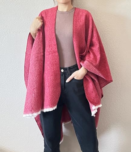 Rose pink open-front fringe poncho with draped sleeves and contrast trim