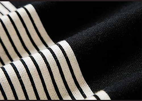 Close-up of striped knit fabric on black poncho sweater with ribbed texture
