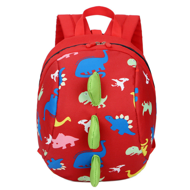 Red kids dinosaur print backpack with front zipper and dangling green charm tags