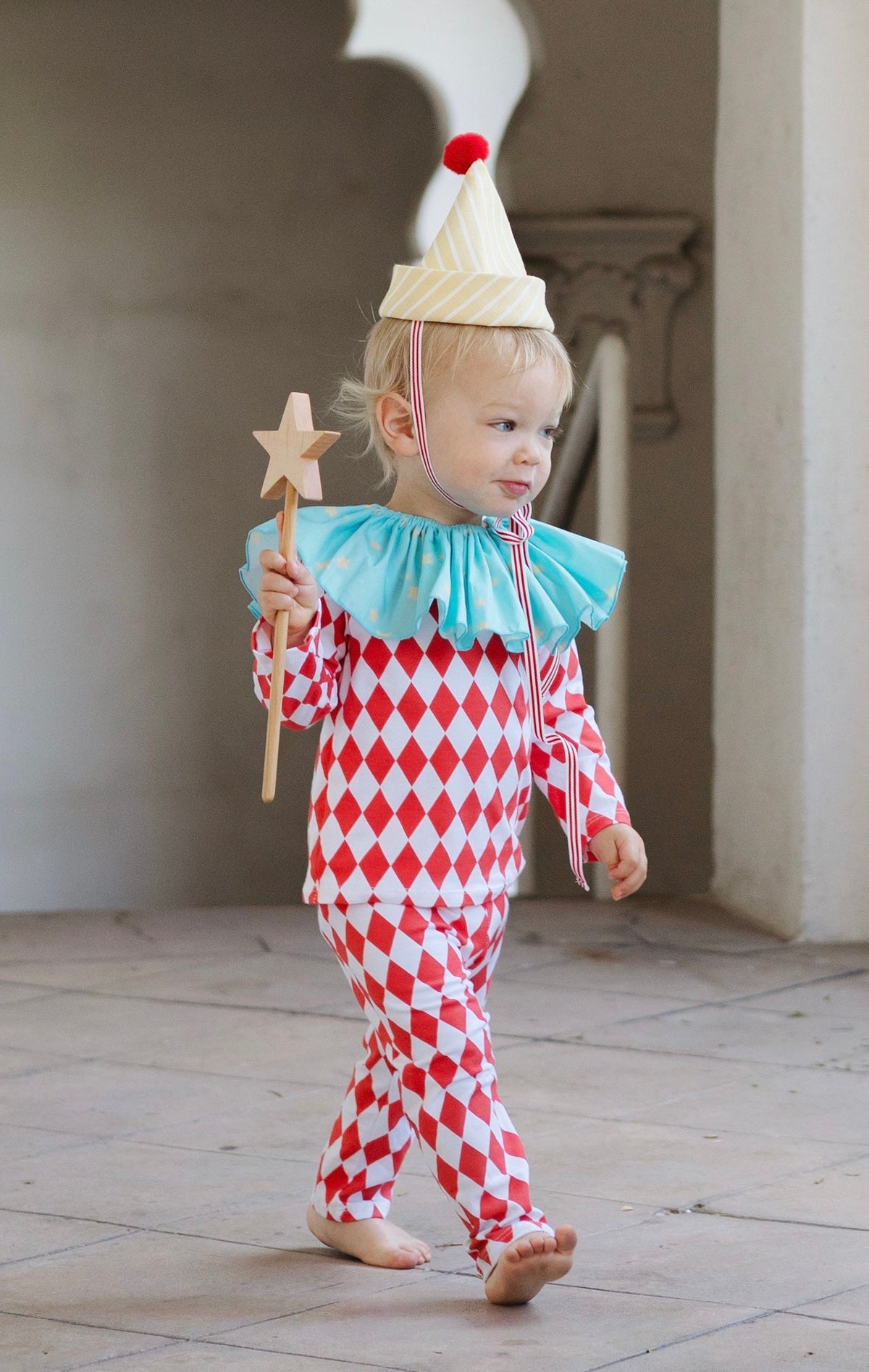 Kids clown outfit: red diamond jumpsuit with light blue ruffled neckline and striped cone hat