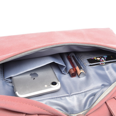 Pink PU leather laptop bag open view with gray lining and phone in main compartment