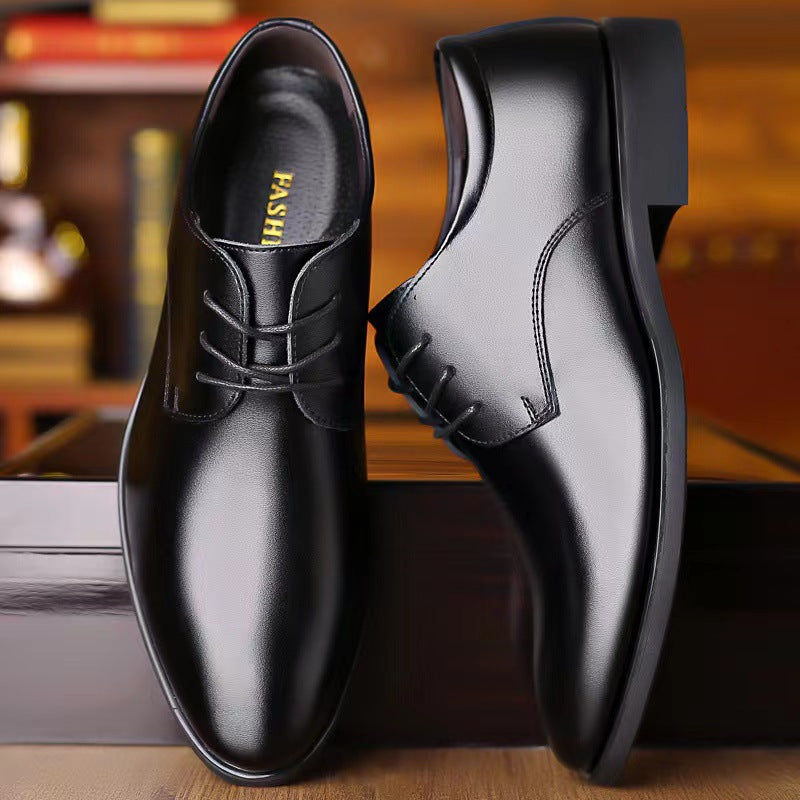 Men's black leather lace-up oxford dress shoes, side view with thick sole.