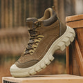 Khaki high-top hiking boot with lace-up closure and thick white lug sole