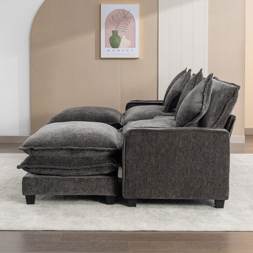 Dark gray sectional sofa with removable ottomans and several square throw pillows