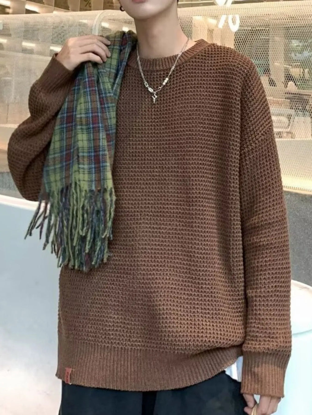 Brown waffle-knit crewneck sweater, long sleeves, relaxed fit